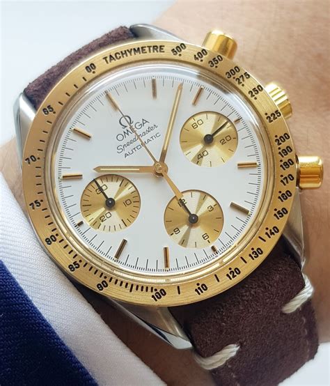 omega speedmaster gold steel